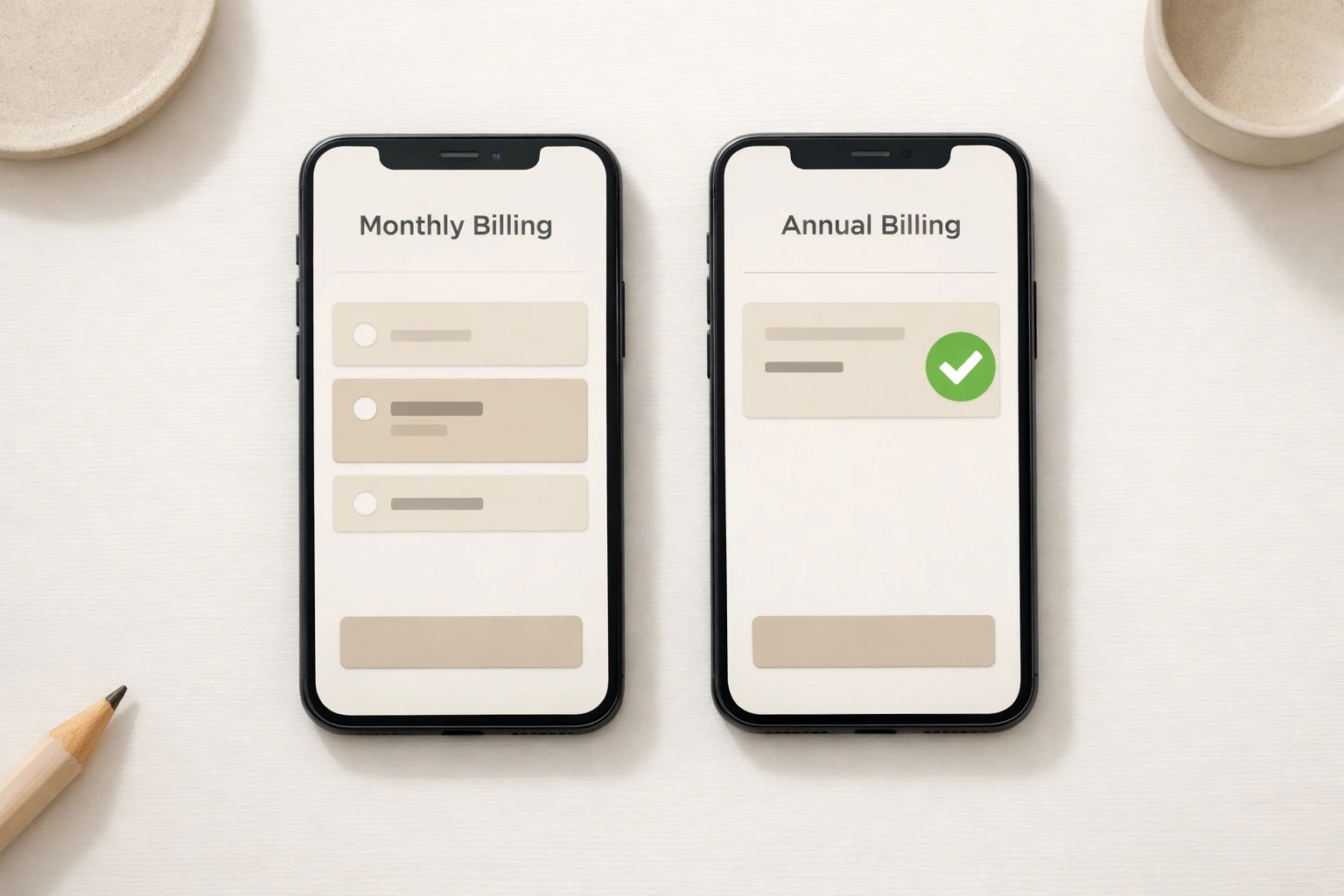 Two smartphones side by side comparing monthly vs annual billing plans